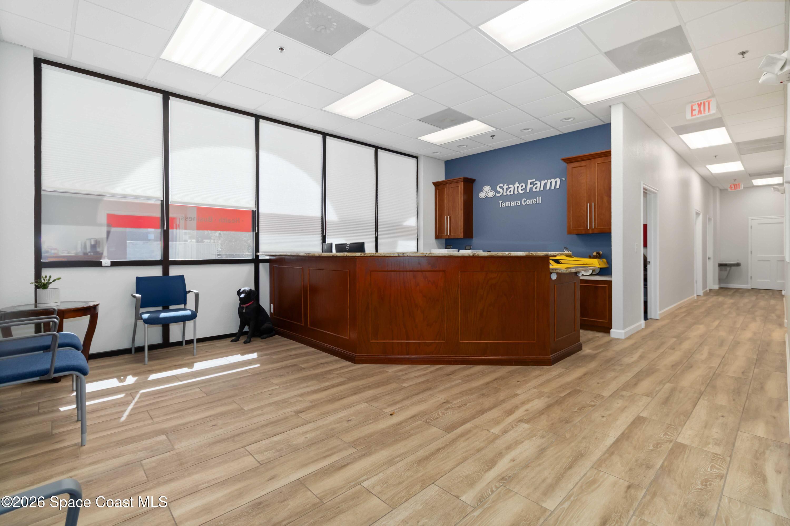 7730 North Wickham Road, Unit 101 Melbourne, FL 32940 - Photo 6 of 48 a view of an empty room with a window