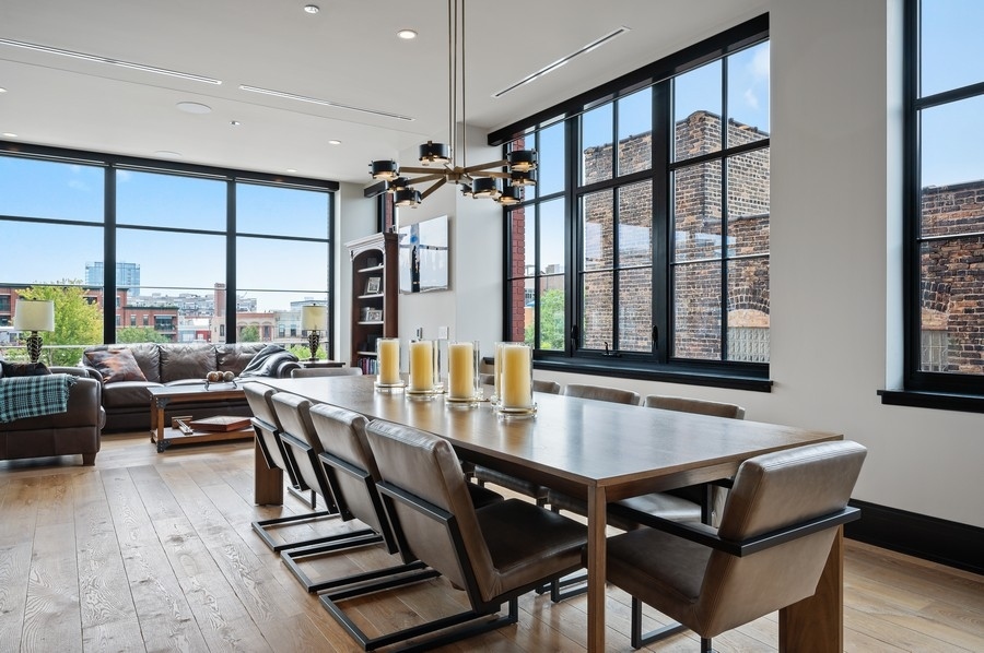 1109 West Washington Boulevard, Unit 4D Chicago, IL 60607 - Photo 12 of 31 a view of a dining room with furniture window and wooden floor