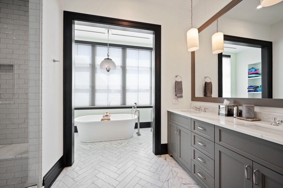 1109 West Washington Boulevard, Unit 4D Chicago, IL 60607 - Photo 18 of 31 a en suite bathroom with a double vanity sink and mirror