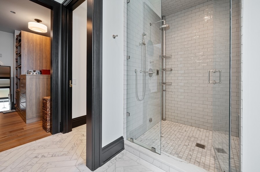 1109 West Washington Boulevard, Unit 4D Chicago, IL 60607 - Photo 20 of 31 a bathroom with a bathtub and a shower