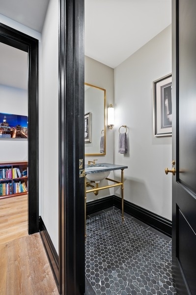 1109 West Washington Boulevard, Unit 4D Chicago, IL 60607 - Photo 26 of 31 a room that has a window and a wooden floor