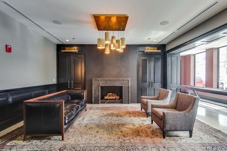 1109 West Washington Boulevard, Unit 4D Chicago, IL 60607 - Photo 31 of 31 a living room with furniture and a fireplace