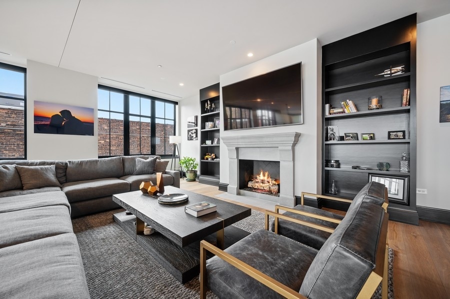 1109 West Washington Boulevard, Unit 4D Chicago, IL 60607 - Photo 4 of 31 a living room with furniture fireplace and flat screen tv