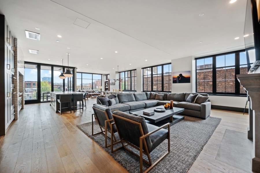 1109 West Washington Boulevard, Unit 4D Chicago, IL 60607 - Photo 7 of 31 a living room with furniture large window and wooden floor