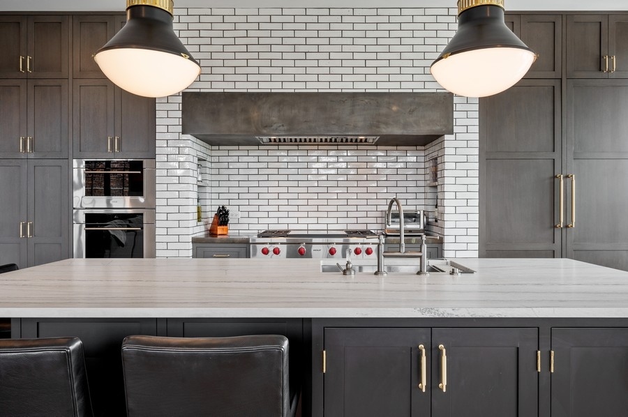 1109 West Washington Boulevard, Unit 4D Chicago, IL 60607 - Photo 9 of 31 a kitchen with a sink cabinets and appliances