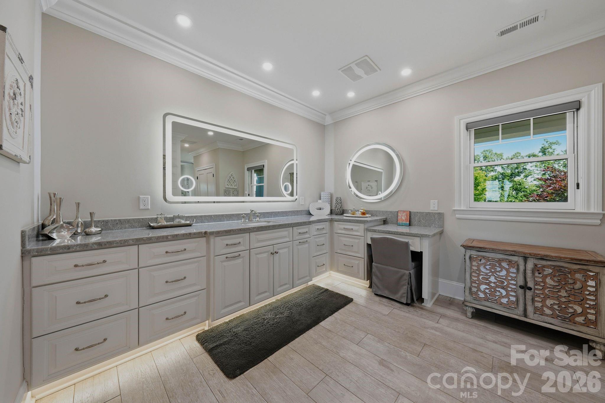 605 Recore Rdg Road Bessemer City, NC 28016 - Photo 16 of 47 a spacious bathroom with a granite countertop double vanity sink a mirror and a window