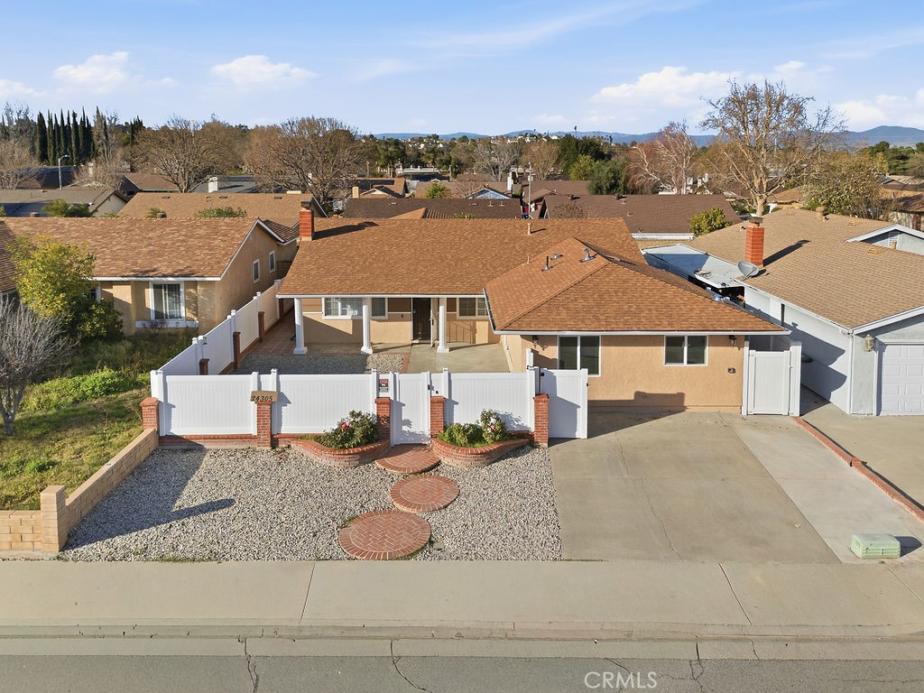24305 Wabuska Street Newhall, CA 91321 - Photo 1 of 1 a front view of a house with a yard
