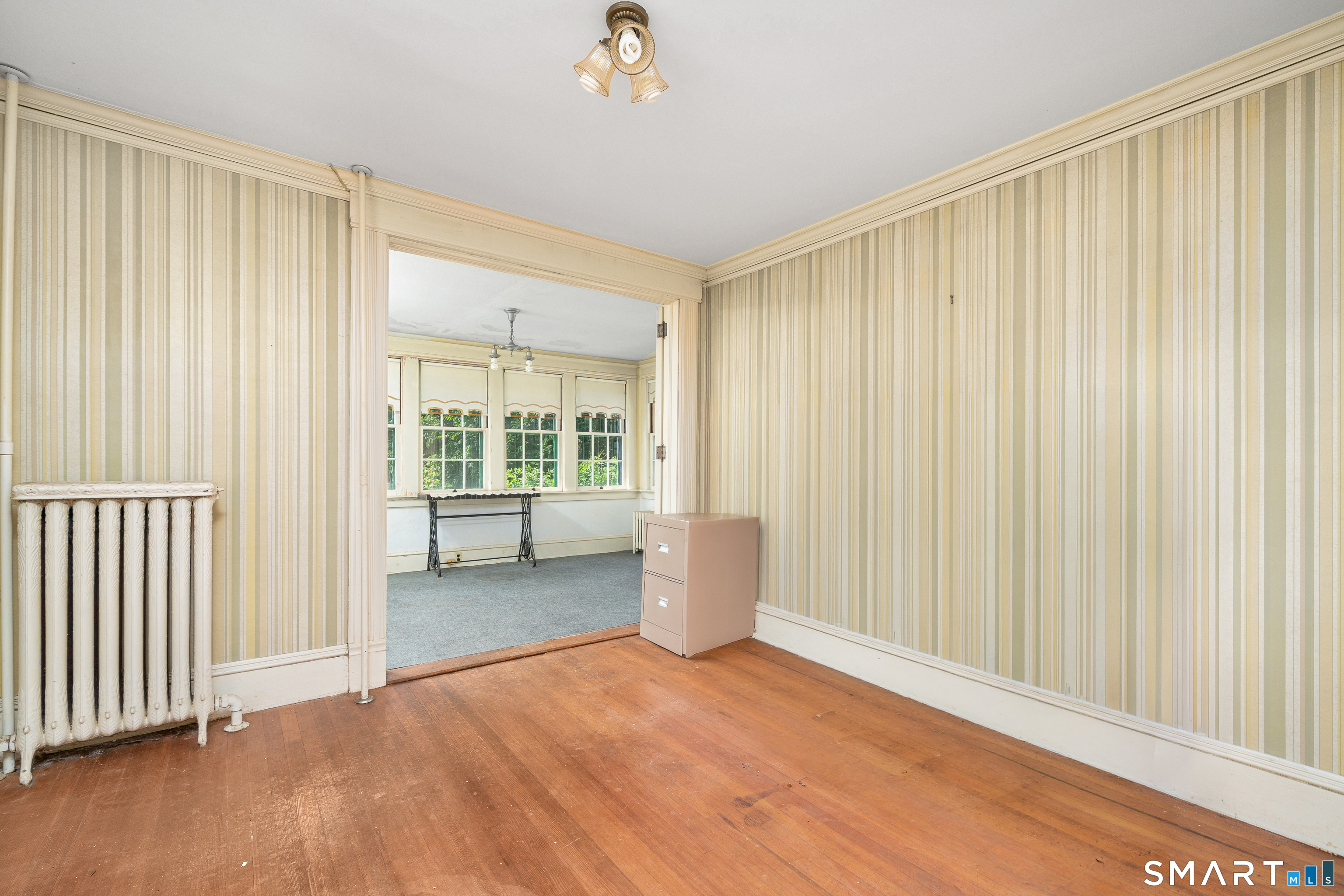 29 South Main Street Windsor Locks, CT 06096 - Photo 11 of 34 One of 3 bedrooms on first floor. This bedroom features a gorgeous sunroom with windows, facing east