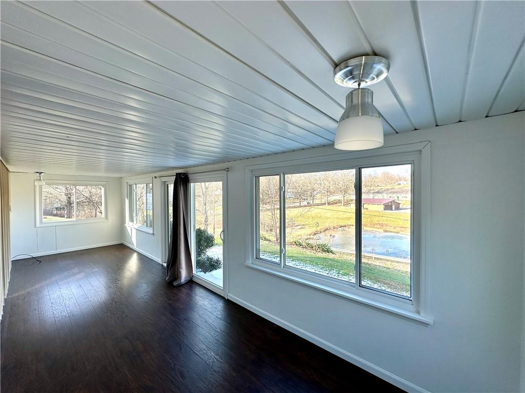 118 Foster Road Beaver Falls, PA 15010 - Photo 27 of 41 a view of an empty room with wooden floor and a window