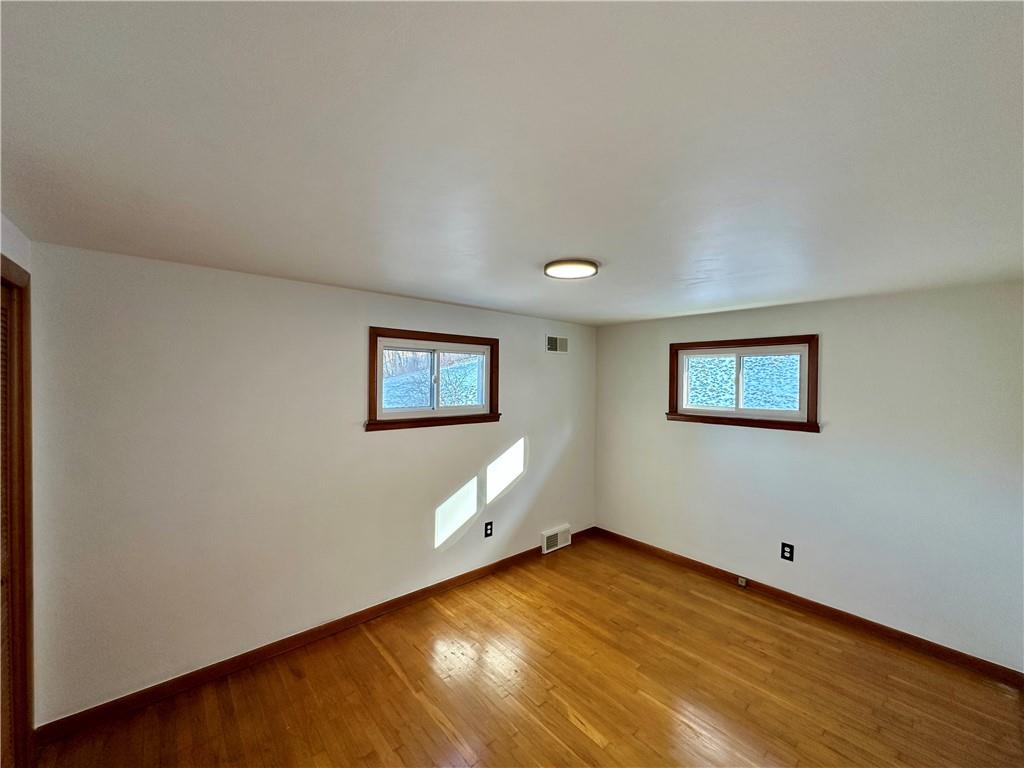 118 Foster Road Beaver Falls, PA 15010 - Photo 30 of 41 a view of empty room with wooden floor