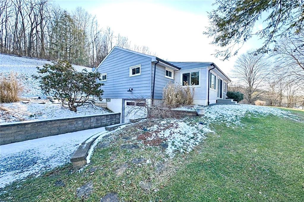 118 Foster Road Beaver Falls, PA 15010 - Photo 4 of 41 a front view of a house with a yard