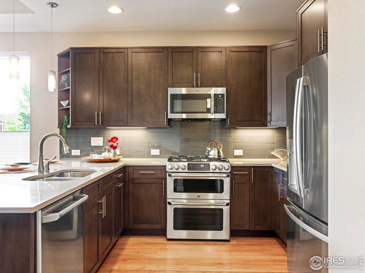 5315 5th Street, Unit A Boulder, CO 80304 - Photo 11 of 32 a kitchen with stainless steel appliances granite countertop a sink stove and refrigerator