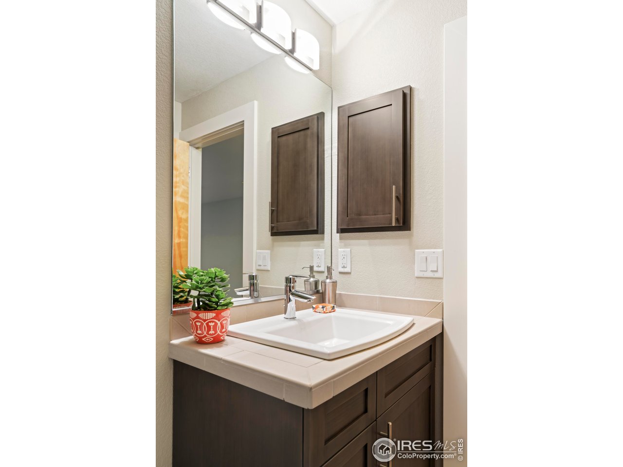5315 5th Street, Unit A Boulder, CO 80304 - Photo 18 of 32 a bathroom with a sink and a mirror