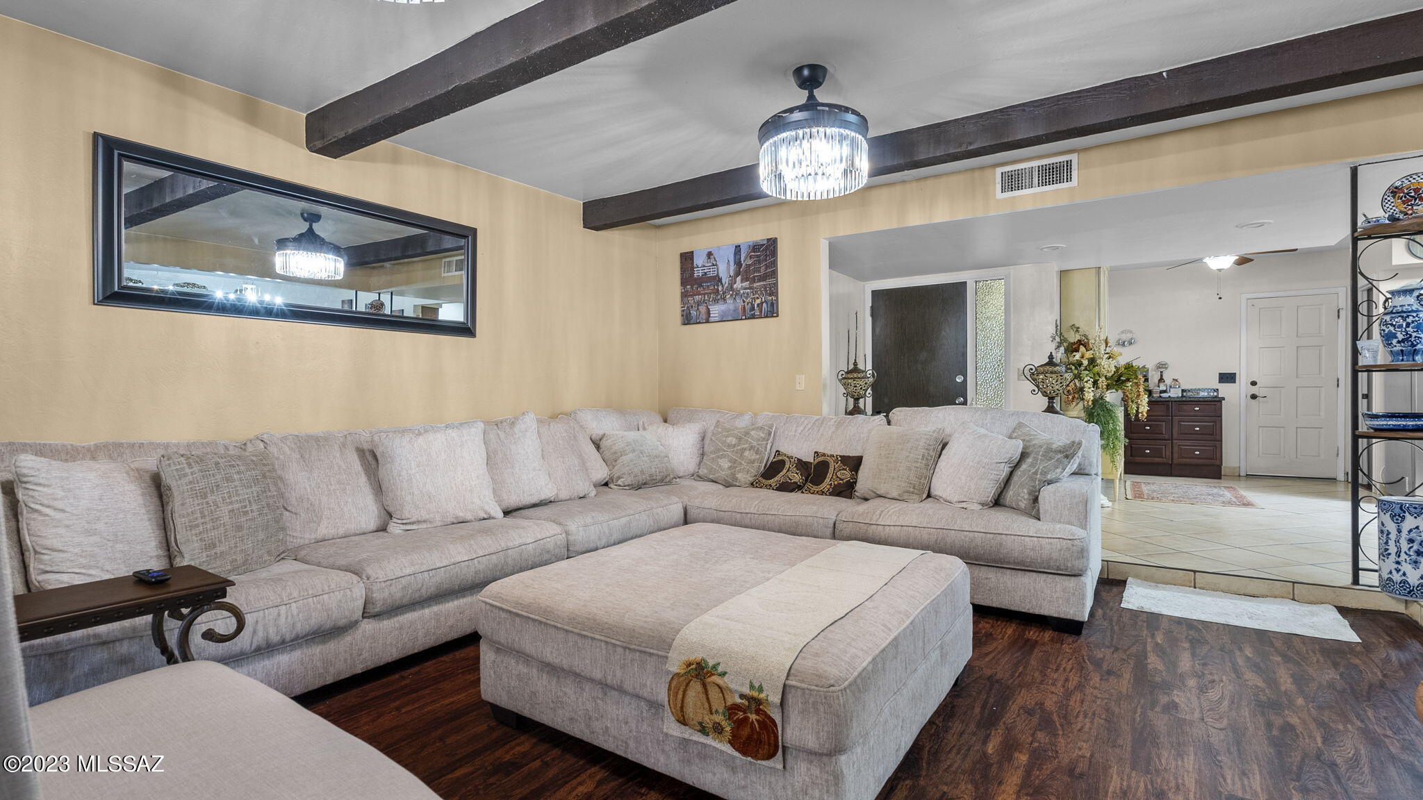 1176 Zircon Court Rio Rico, AZ 85648 - Photo 11 of 26 a living room with furniture and a chandelier