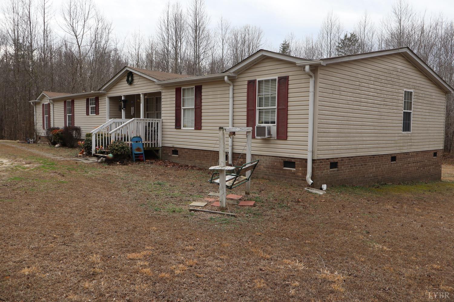 195 Casey Circle Keeling, VA 24566 - Photo 10 of 11 a backyard of a house with barbeque oven table and chairs