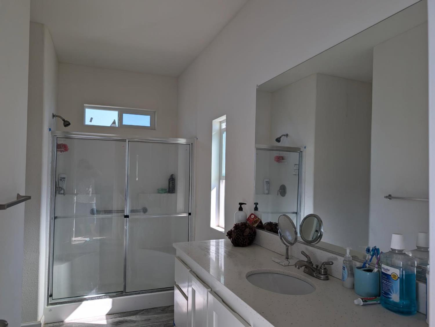709 Encina Grande Road Berry Creek, CA 95916 - Photo 8 of 12 a bathroom with double vanity sink a mirror and shower