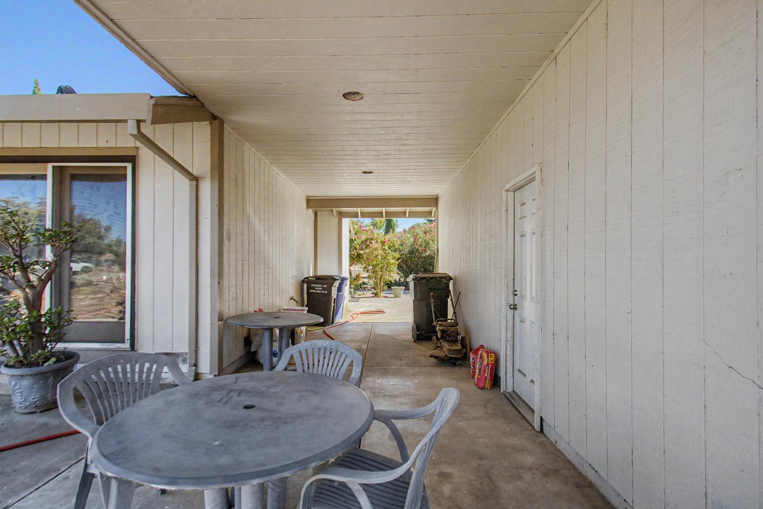 1180 Sunset Road Brentwood, CA 94513 - Photo 32 of 72 breeze way between house and semi attached garage. Car could fit.