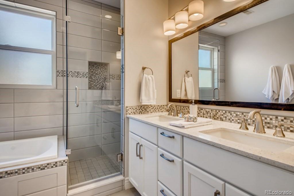 3234 Stuart Street Denver, CO 80212 - Photo 22 of 40 a bathroom with a double vanity sink mirror and shower