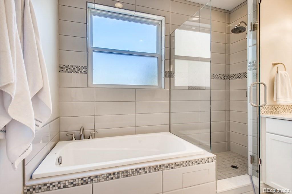 3234 Stuart Street Denver, CO 80212 - Photo 23 of 40 a bathroom with a bathtub and shower
