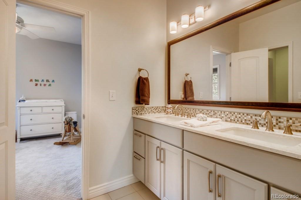 3234 Stuart Street Denver, CO 80212 - Photo 27 of 40 a bathroom with a sink and a mirror