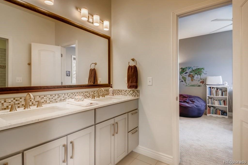 3234 Stuart Street Denver, CO 80212 - Photo 28 of 40 a bathroom with a sink and a mirror