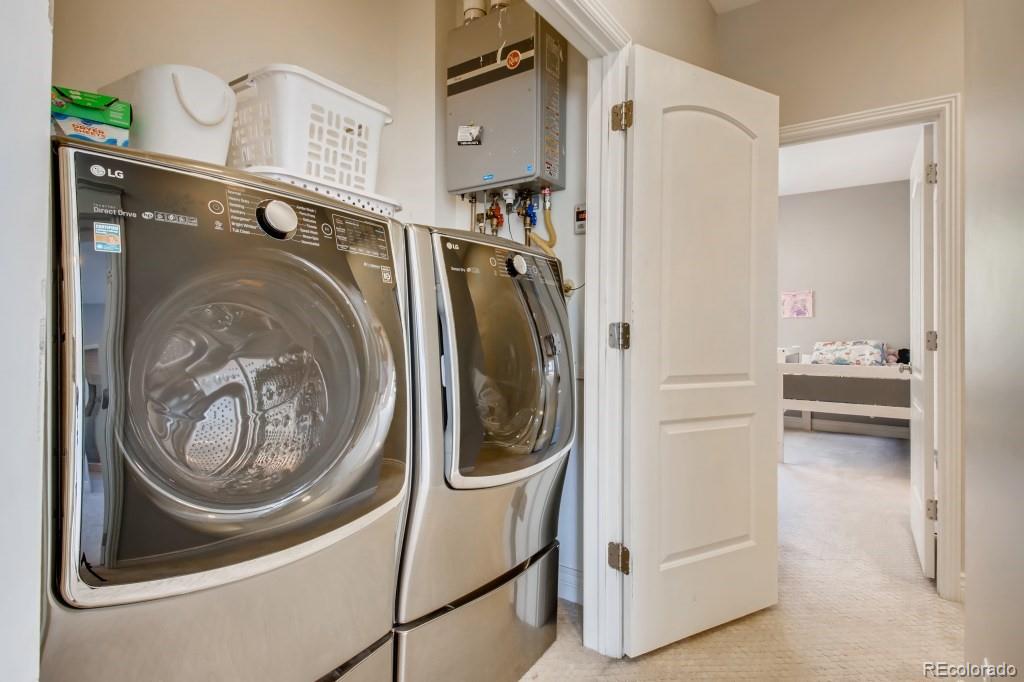 3234 Stuart Street Denver, CO 80212 - Photo 30 of 40 a utility room with dryer and washer