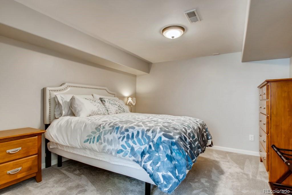 3234 Stuart Street Denver, CO 80212 - Photo 33 of 40 a bedroom with a bed and a closet