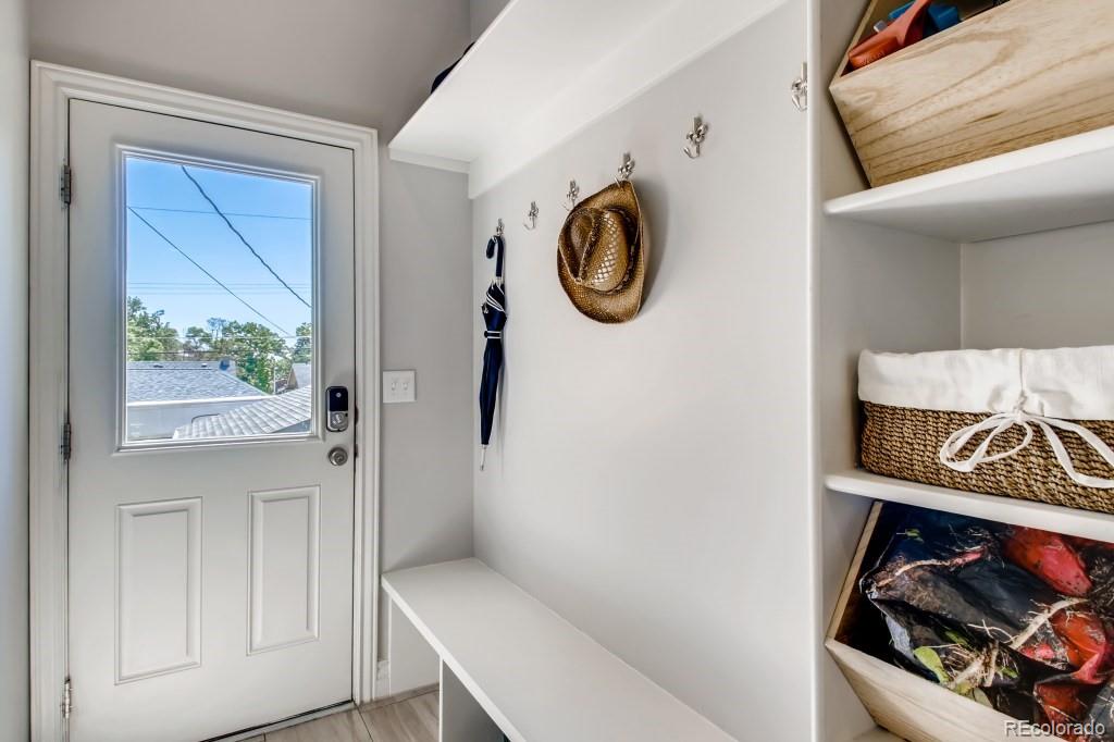 3234 Stuart Street Denver, CO 80212 - Photo 35 of 40 a view of walk in closet with clothes and shoes
