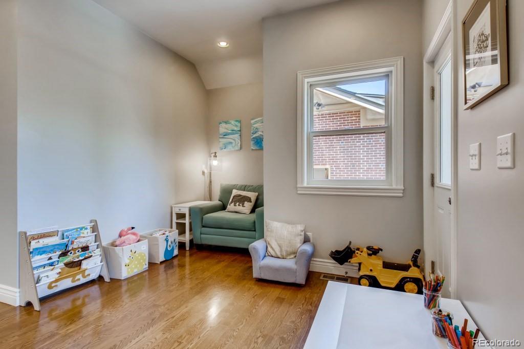 3234 Stuart Street Denver, CO 80212 - Photo 36 of 40 a bedroom with furniture and a wooden floor