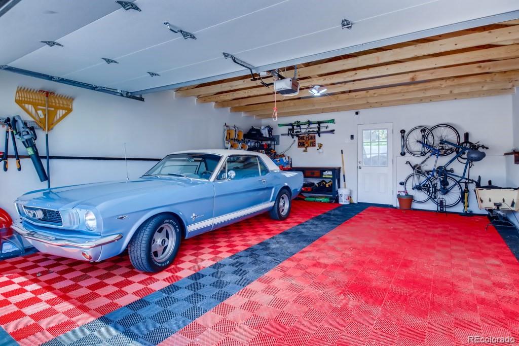 3234 Stuart Street Denver, CO 80212 - Photo 37 of 40 a view of a garage with parked cars