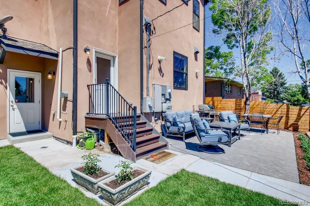 3234 Stuart Street Denver, CO 80212 - Photo 38 of 40 a view of a patio with couches table and chairs and potted plants