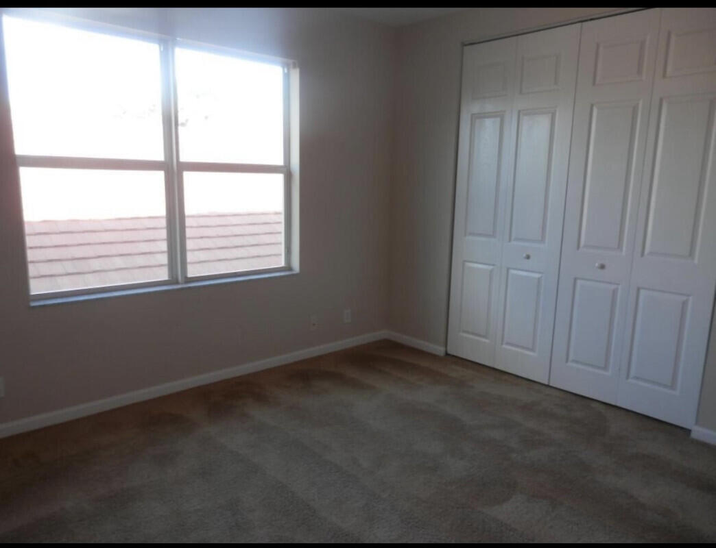 8726 Tally Ho Lane West Palm Beach, FL 33411 - Photo 19 of 33 a view of an empty room with a window