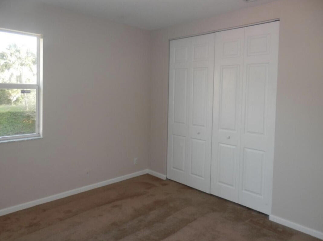 8726 Tally Ho Lane West Palm Beach, FL 33411 - Photo 20 of 33 an empty room with a window