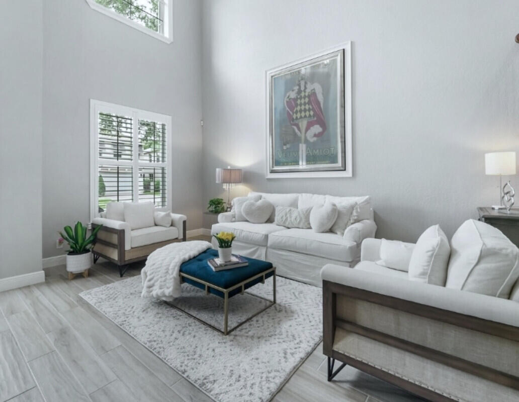 8726 Tally Ho Lane West Palm Beach, FL 33411 - Photo 2 of 33 a living room with furniture and wooden floor