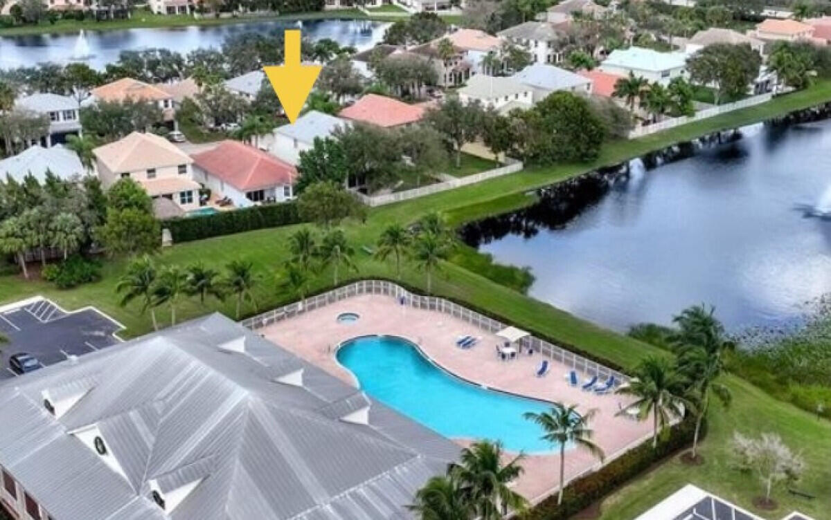 8726 Tally Ho Lane West Palm Beach, FL 33411 - Photo 25 of 33 an aerial view of a house with a lake view