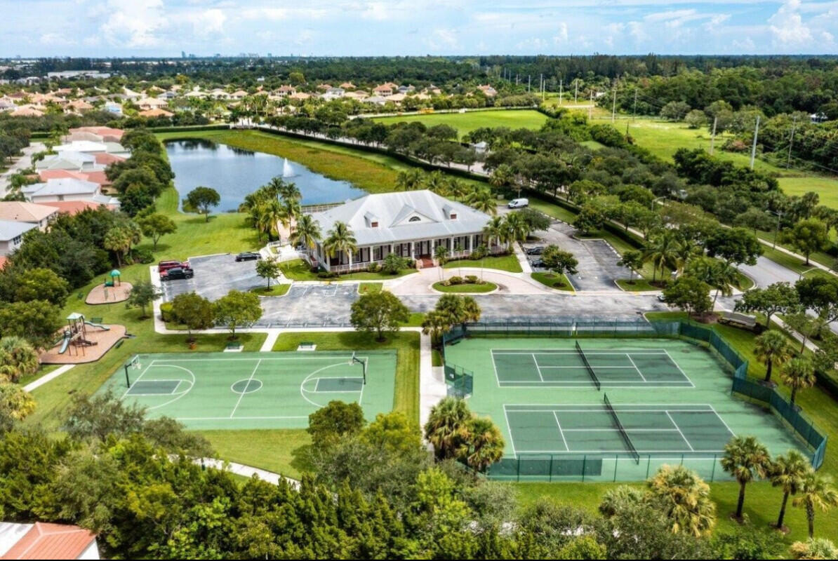 8726 Tally Ho Lane West Palm Beach, FL 33411 - Photo 27 of 33 an aerial view of residential houses with outdoor space and swimming pool