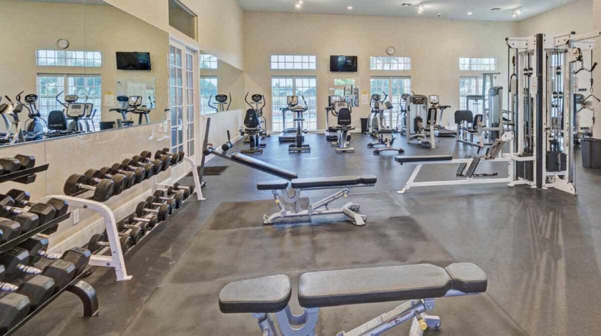 8726 Tally Ho Lane West Palm Beach, FL 33411 - Photo 29 of 33 a room with lots of chairs and mirrors