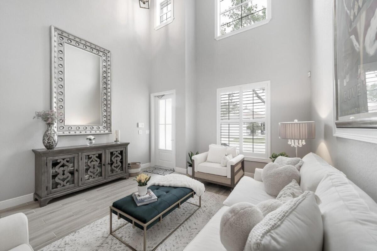 8726 Tally Ho Lane West Palm Beach, FL 33411 - Photo 3 of 33 a living room with furniture and a large window