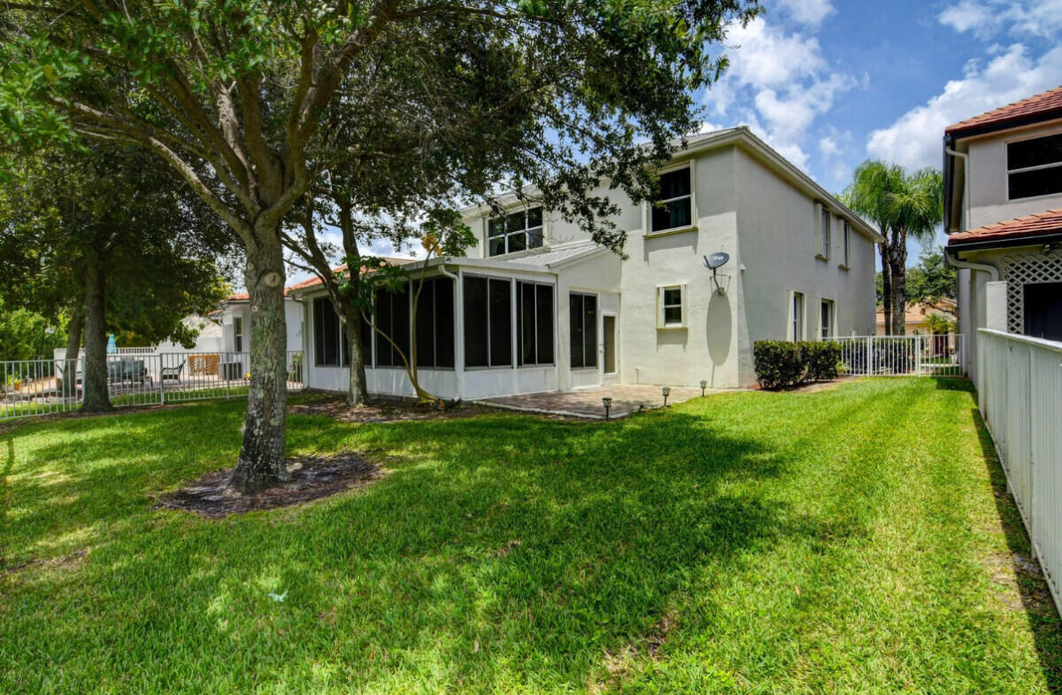 8726 Tally Ho Lane West Palm Beach, FL 33411 - Photo 31 of 33 a view of a house with yard and tree s