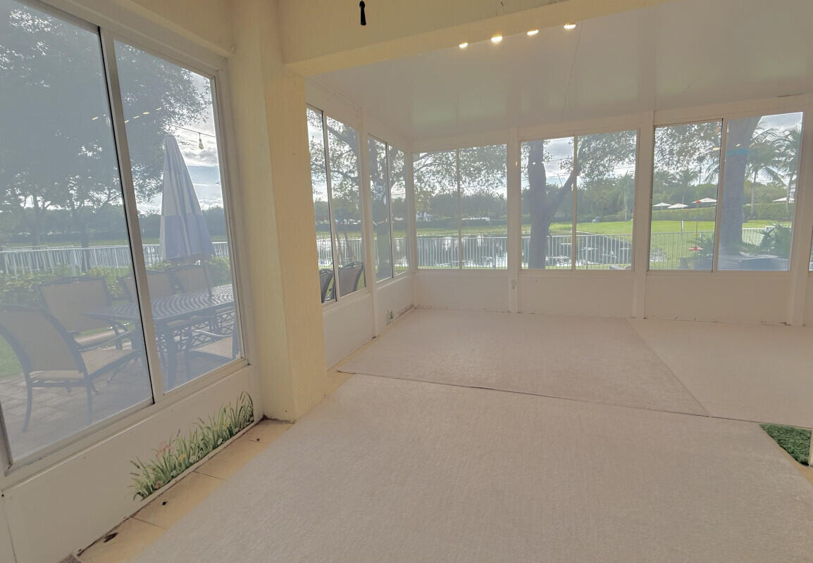 8726 Tally Ho Lane West Palm Beach, FL 33411 - Photo 10 of 33 a living room with large windows