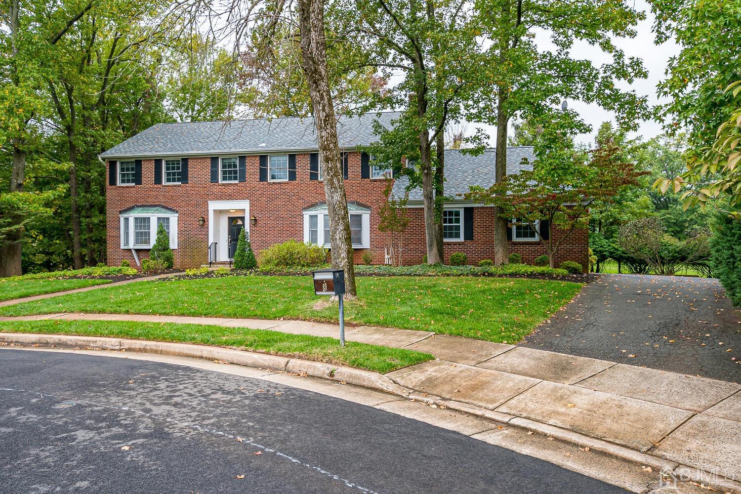 8 Bluebird Court Edison, NJ 08820 - Photo 11 of 15 a front view of a house with a yard and trees