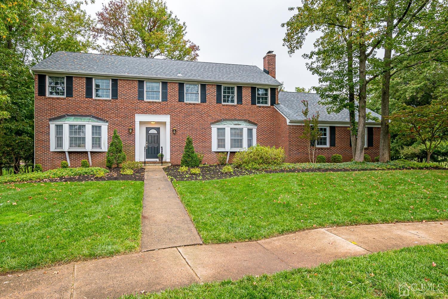 8 Bluebird Court Edison, NJ 08820 - Photo 13 of 15 a front view of a house with yard