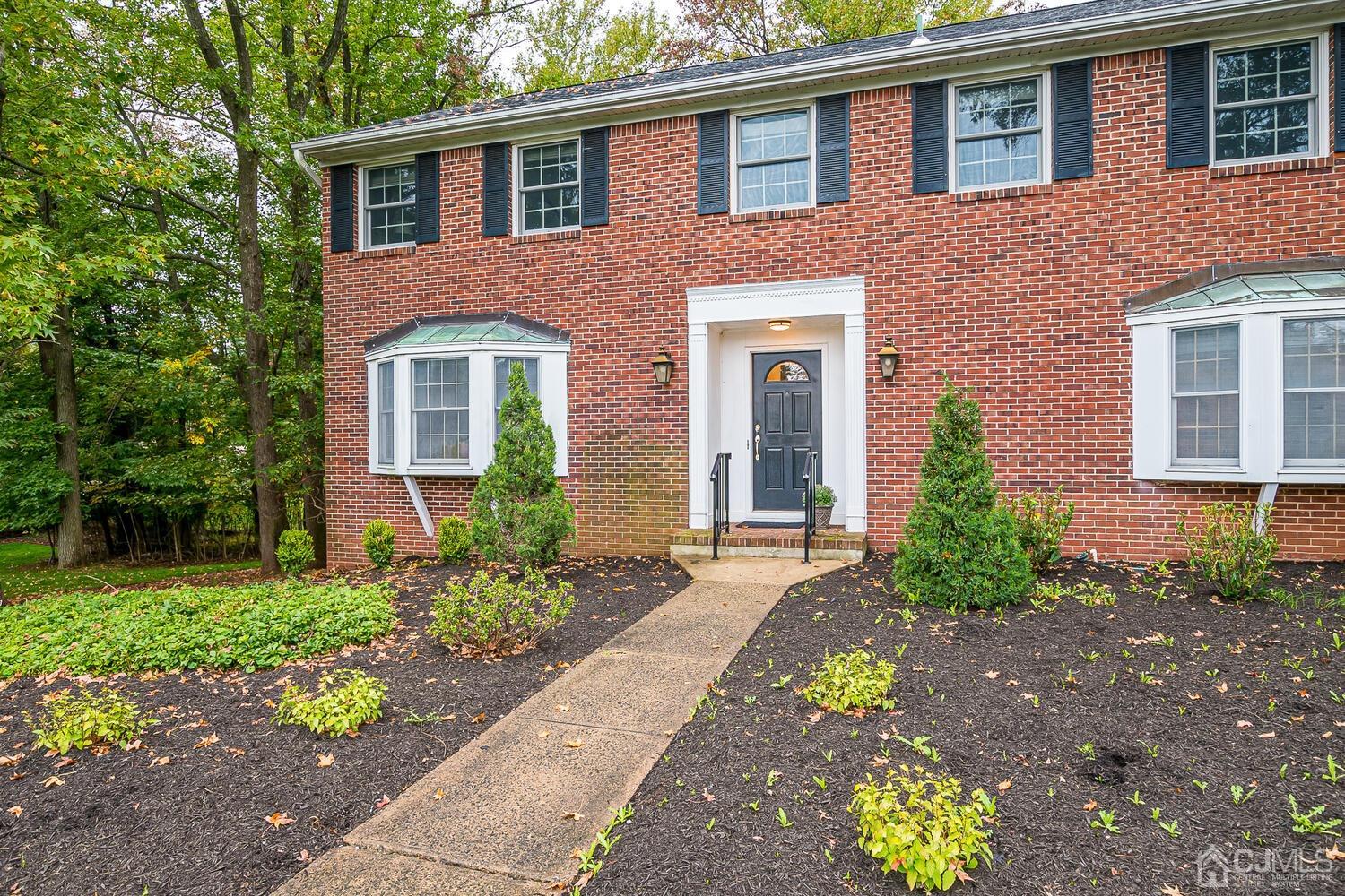 8 Bluebird Court Edison, NJ 08820 - Photo 14 of 15 a front view of a house with a yard