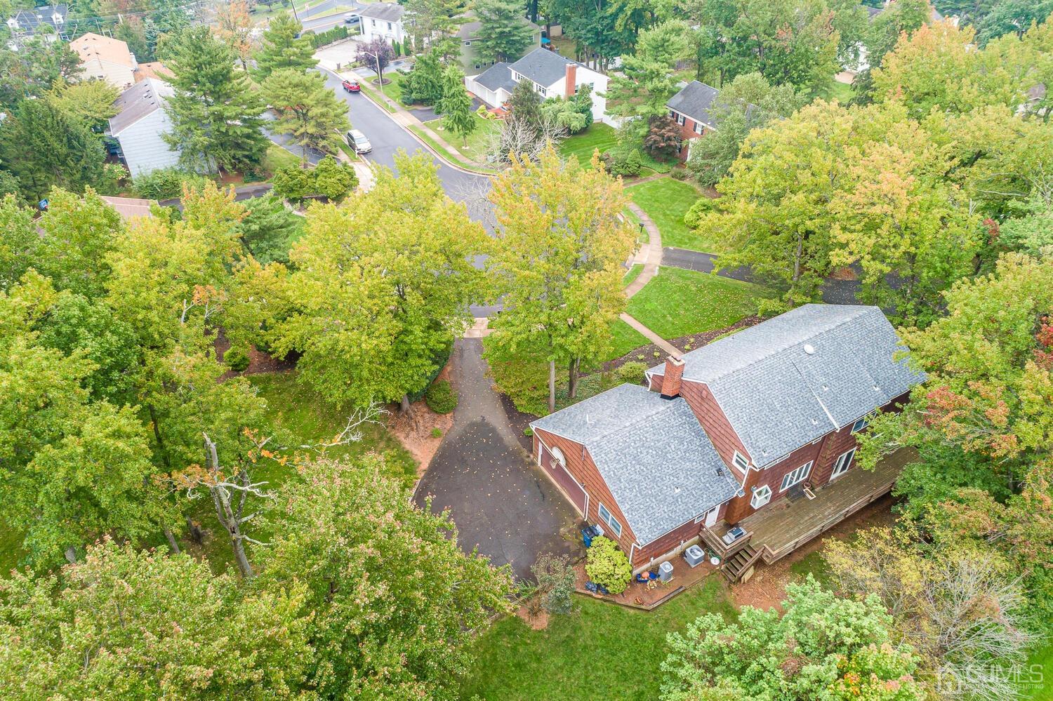 8 Bluebird Court Edison, NJ 08820 - Photo 9 of 15 an aerial view of residential house with outdoor space and trees all around