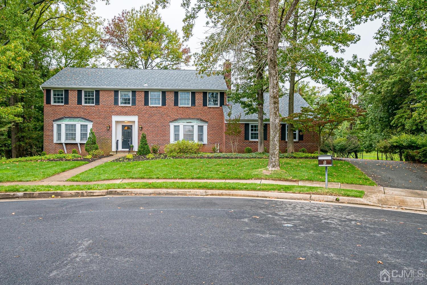 8 Bluebird Court Edison, NJ 08820 - Photo 10 of 15 a view of a house with a big yard and large trees