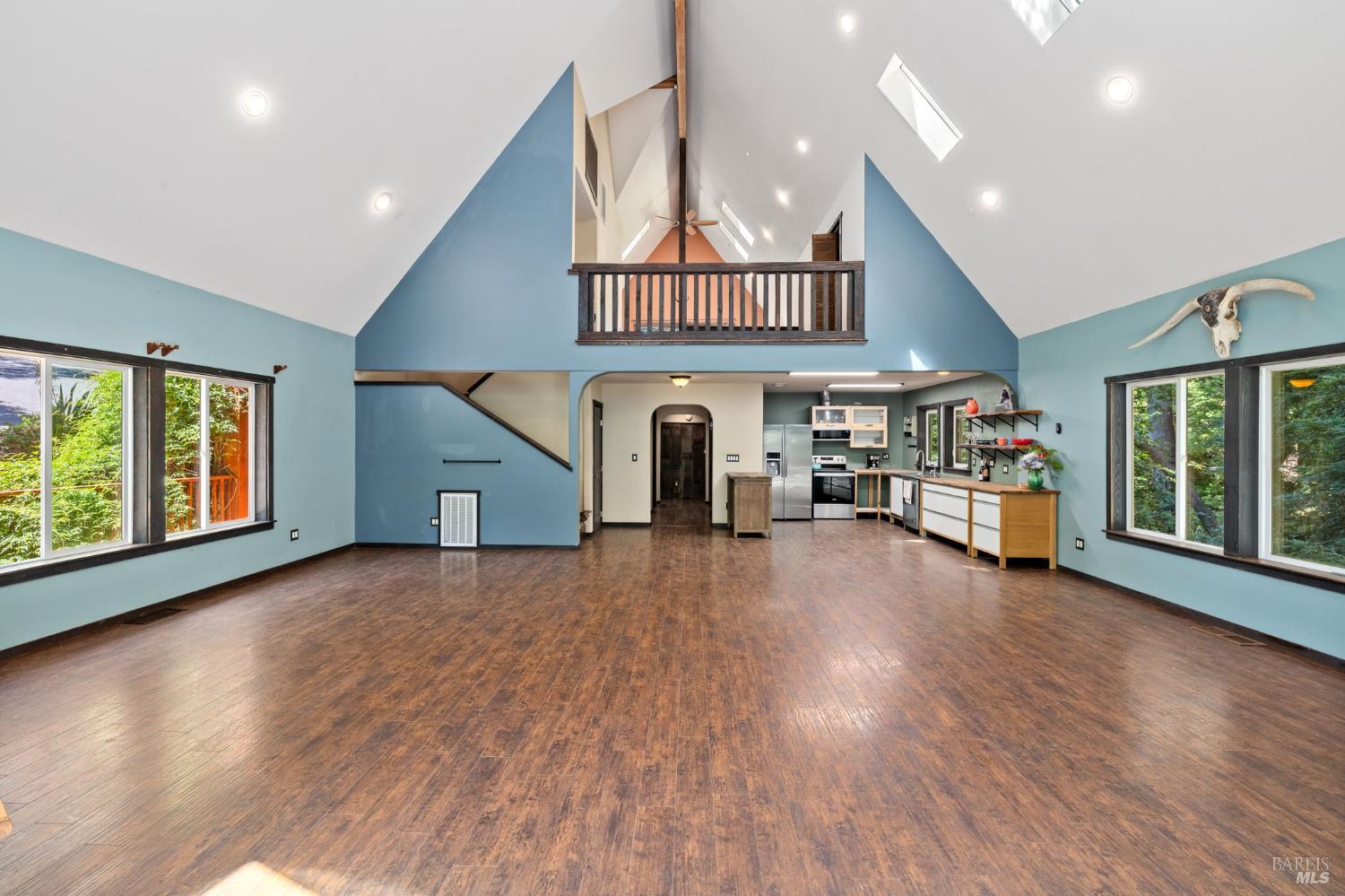 9935 Occidental Road Sebastopol, CA 95472 - Photo 9 of 59 View of the kitchen, hallway, and the primary suite upstairs