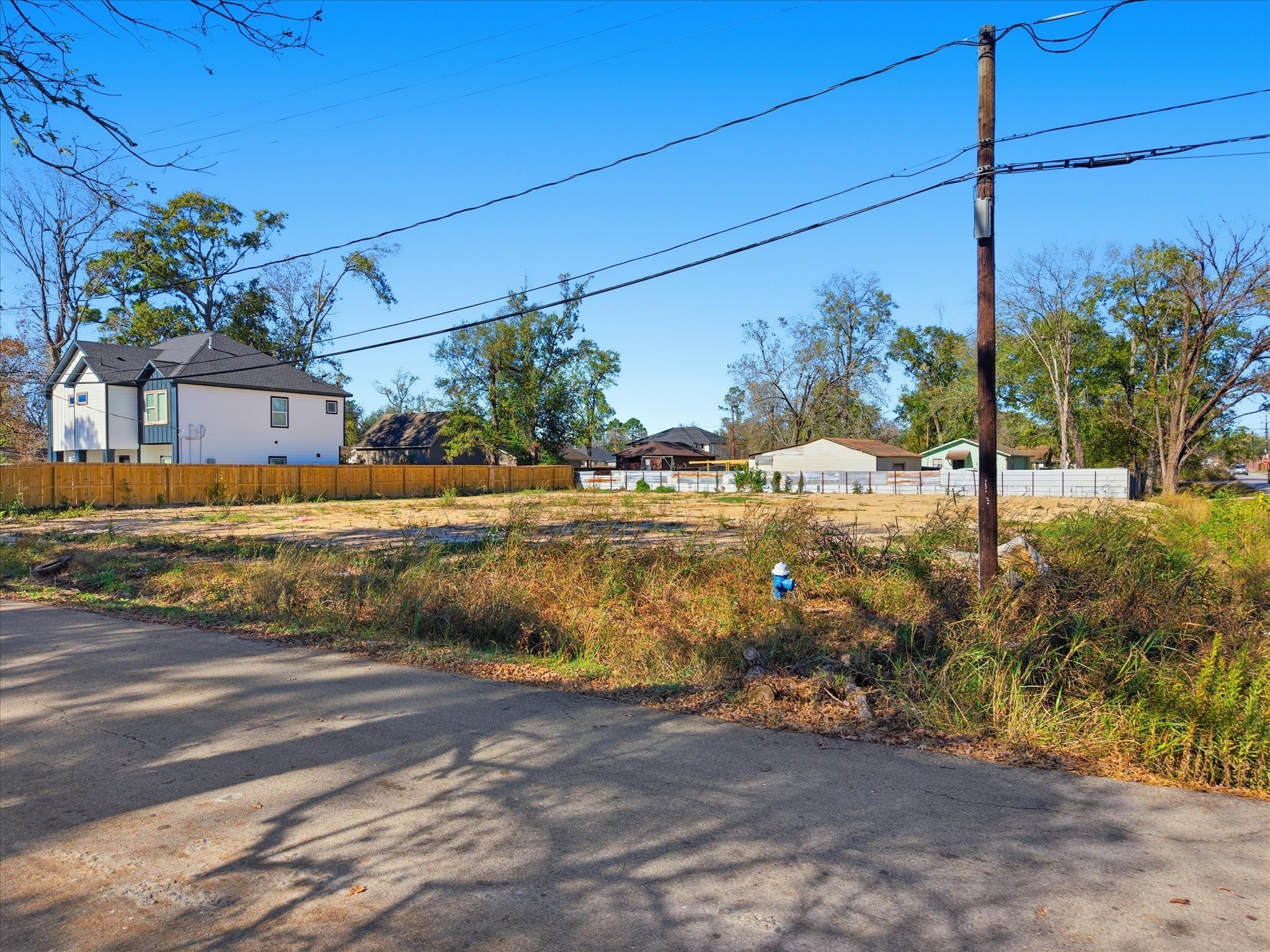 8227 Hamlet Street Houston, TX 77078 - Photo 17 of 17 a view of a house with a yard
