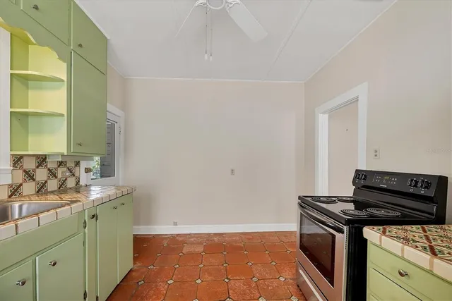a kitchen with a stove and a sink
