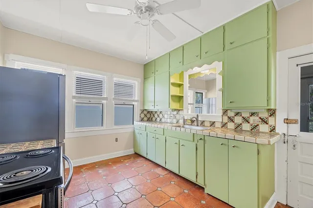 a bathroom with a sink mirror and a bathtub