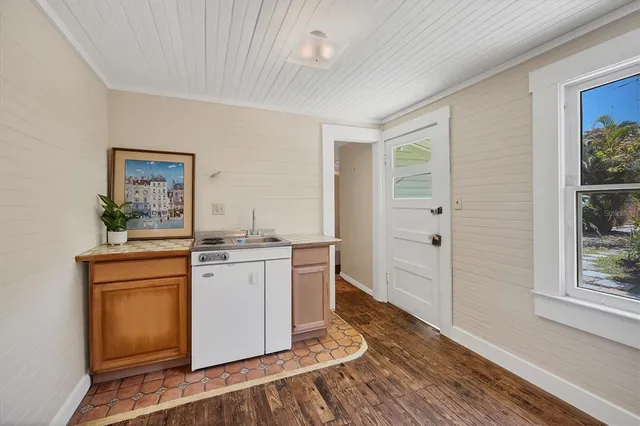 a room with a stove and a window